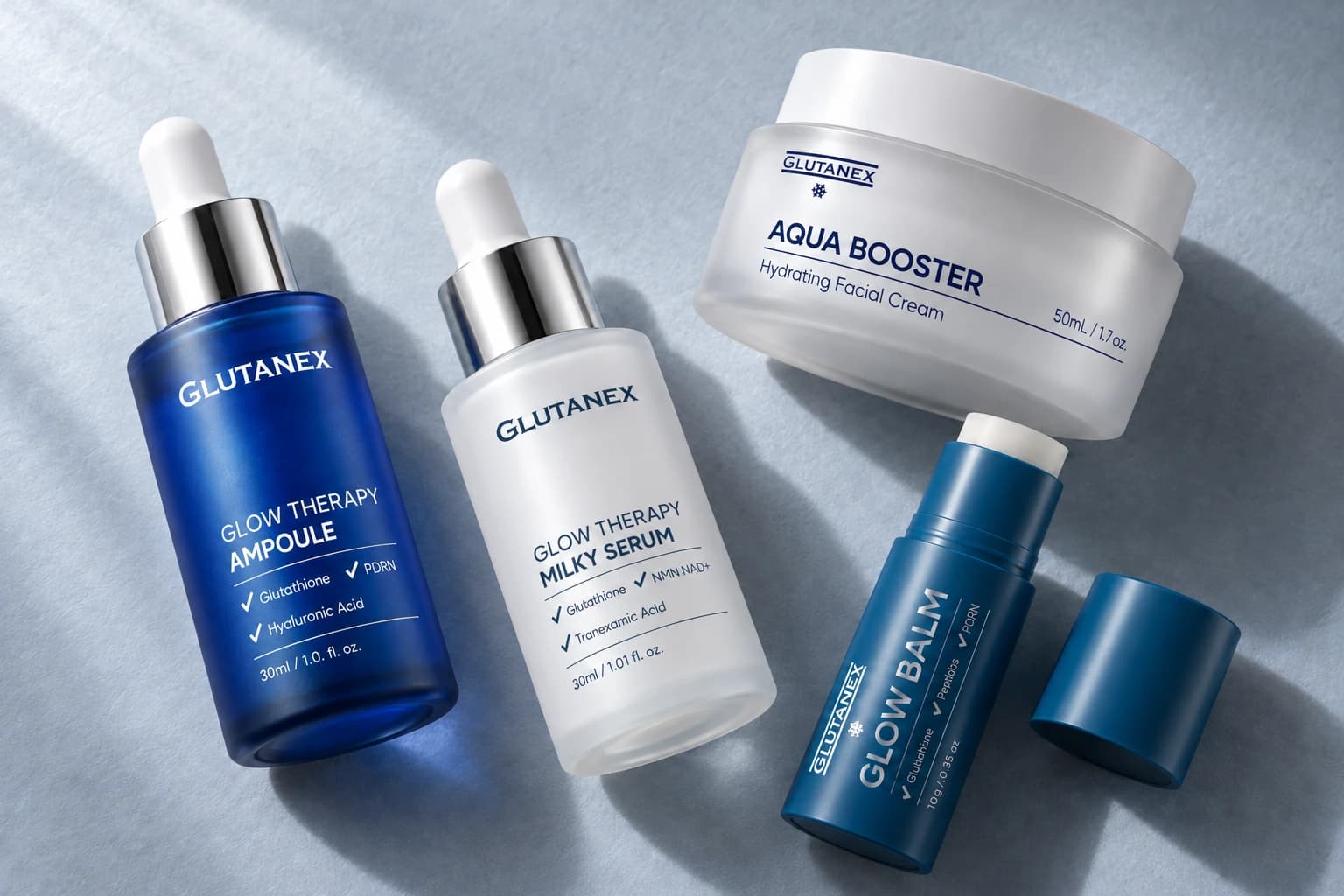 실제 GLUTANEX 글로우 테라피 앰플·밀키 세럼·아쿠아 부스터·글로우 밤을 회청색 바탕에 함께 연출한 AI 에디토리얼 이미지